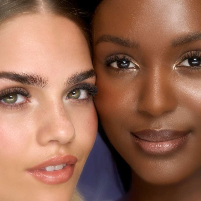 Close up of two models with lash extensions
