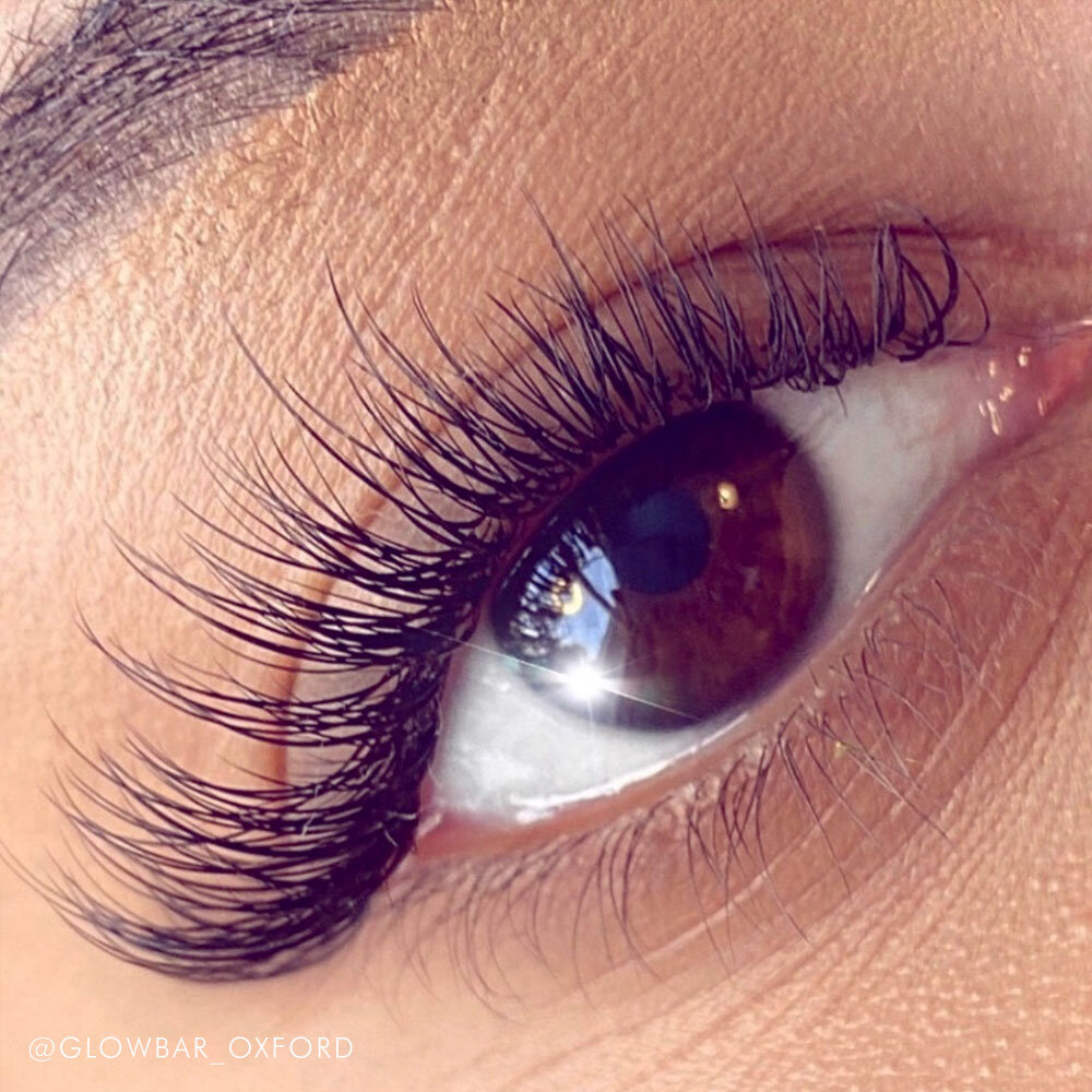 individual eyelash extensions brown eyes close up